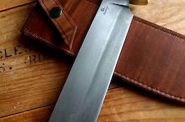 Custom camp knife with a differentially hardened blade, brass fittings and a stag handle