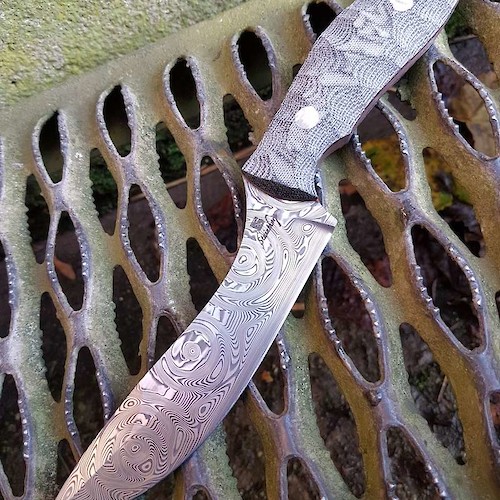 Full sized Evo in grosserosen Damasteel and black canvas micarta